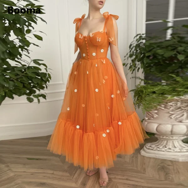 Sweetheart orange prom dresses with bow straps and tea-length A-line design